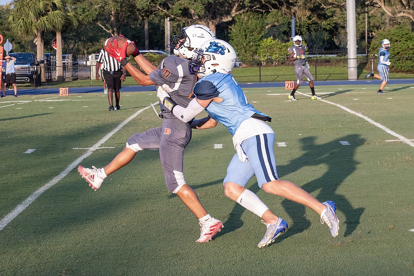 ODA sophomore defensive back Dylan Walker puts a hit on Berean Christian wideout Tajauni Elliot.