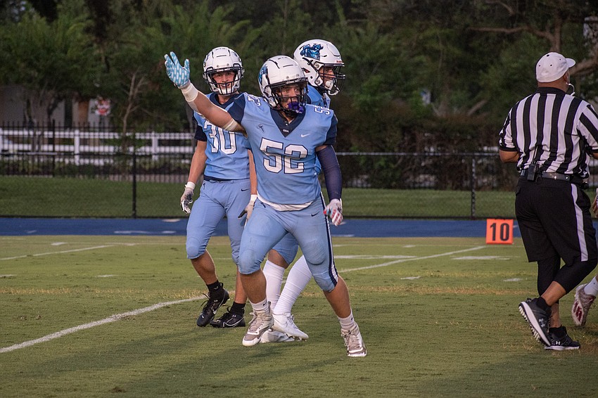 ODA senior linebacker Chase Taraska signals for a change in possession after recovering a fumble against Berean Christian.