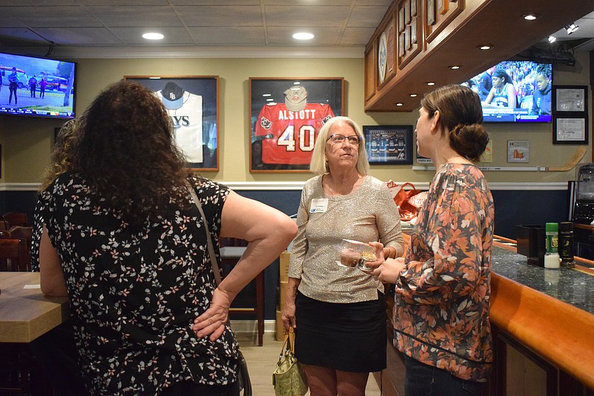 Chamber members mingle after Networking at Noon on Aug. 24.