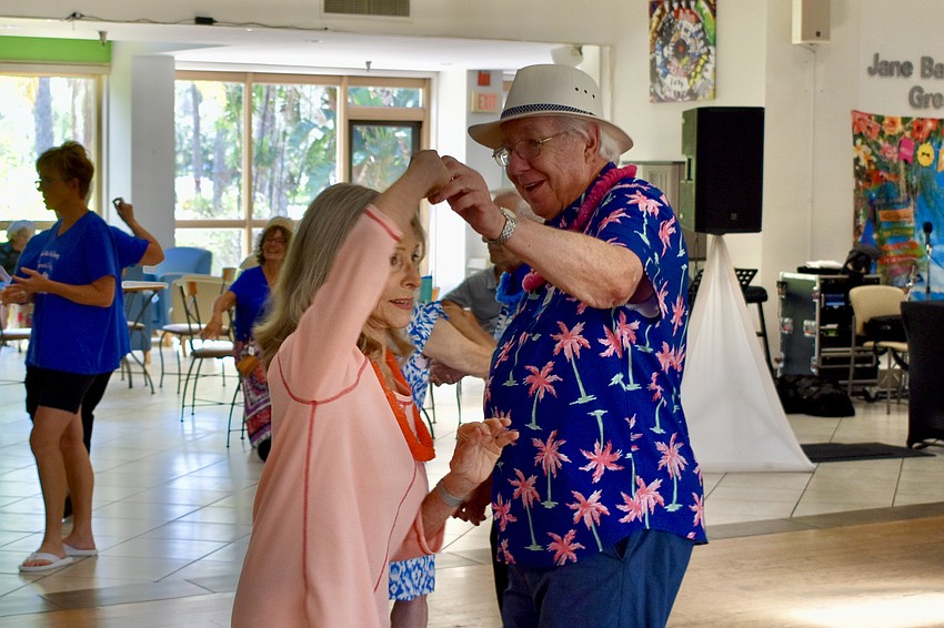 Liz Cantwell and Ron Longhurst dance together.