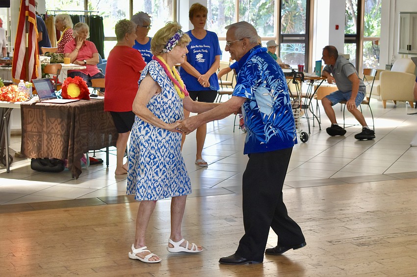 Lucille Pererva and Frank Cefola dance together.
