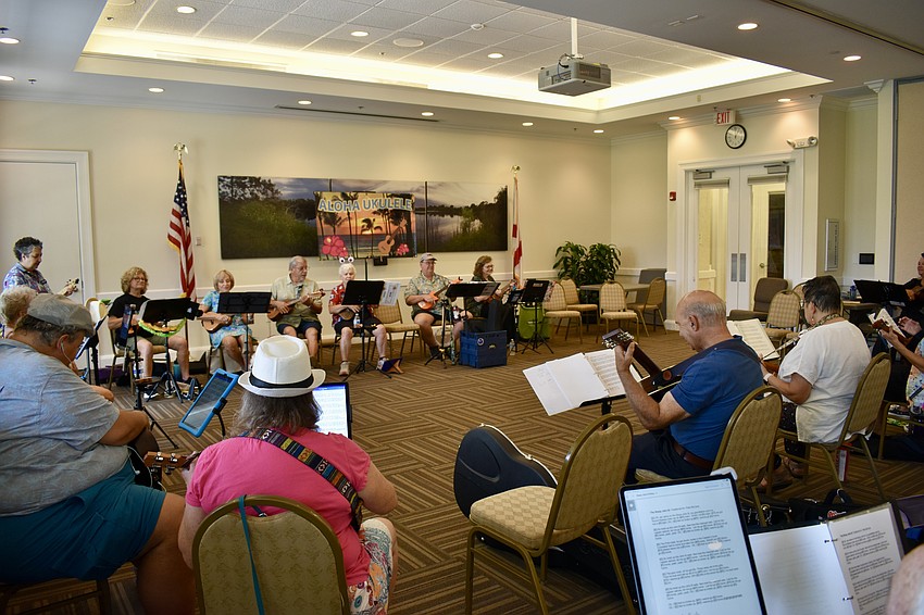 About 35 Lakewood Ranch residents play ukuleles and guitars at Town Hall to celebrate Music on the Porch Day.