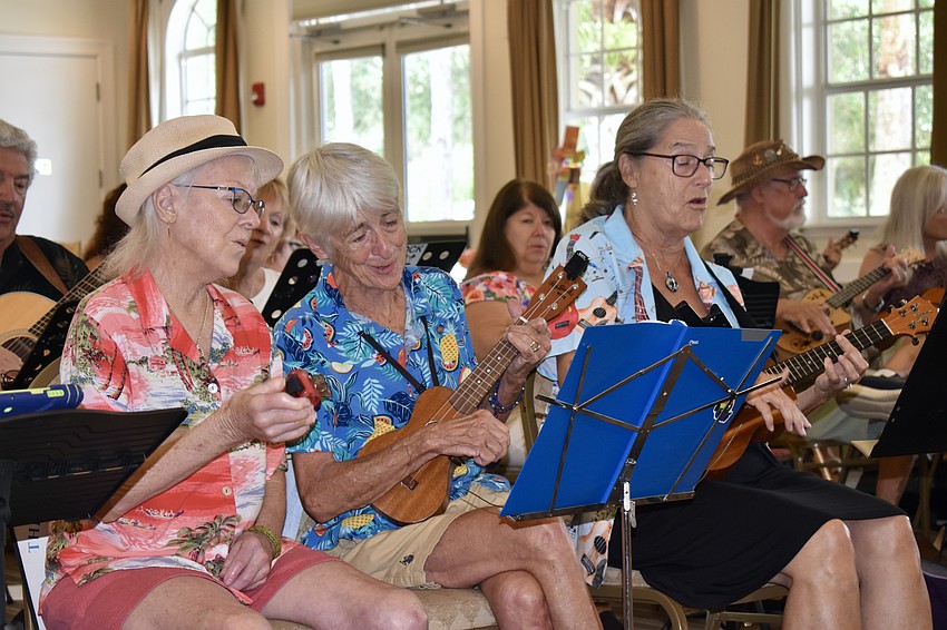 Patricia Hebert, Cynthia Hebert and Darlene Oaks join in for Play Music on the Porch Day. The trio has their own ukulele band that plays around Sarasota called 
