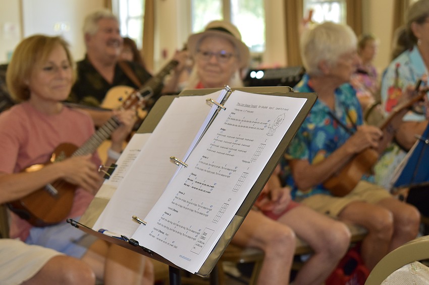 Musicians arrive prepared with music stands holding either paper or electronic sheet music to play along with the group.