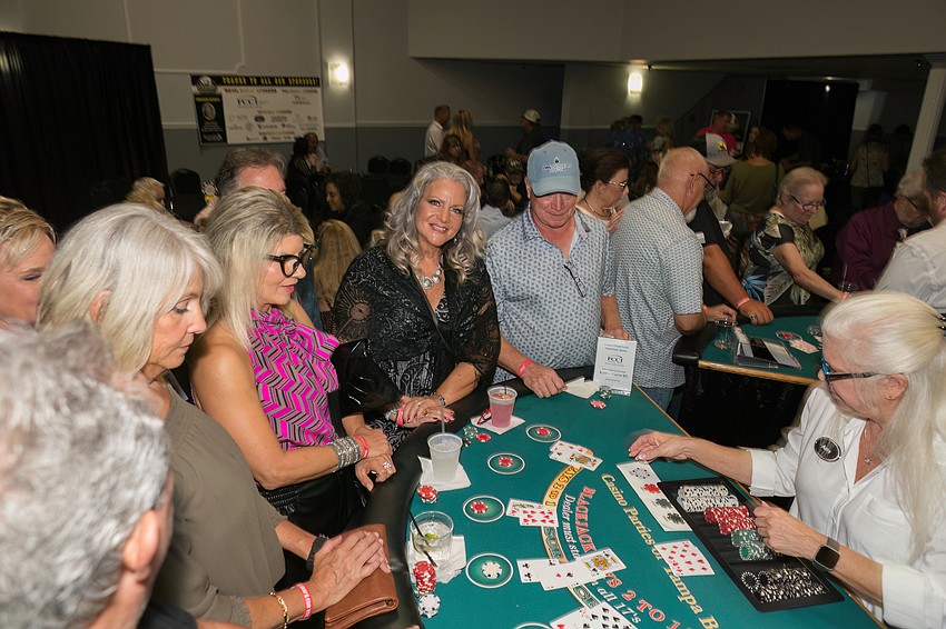 Players crowd the blackjack tables at Suncoast Charities for Children's Casino Night.