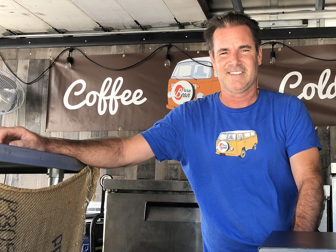 Chris Diedrich, owner of Pura Bean Coffee Company, inside the Pura Bean Coffee Company coffee truck.