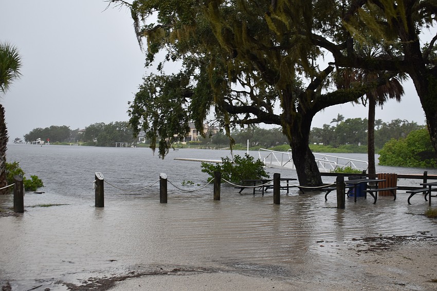 The Manatee River takes over the picnic area at Fort Hamer Park on Wednesday morning.