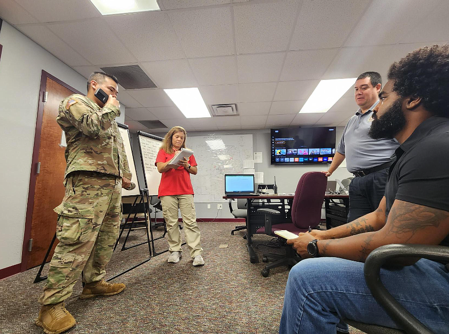 Emergency Management Director Jonathan Lord and Emergency Management Planner Nealon Joseph (both sitting on the right) are briefed before they head to Madison County. Photo courtesy of Flagler County