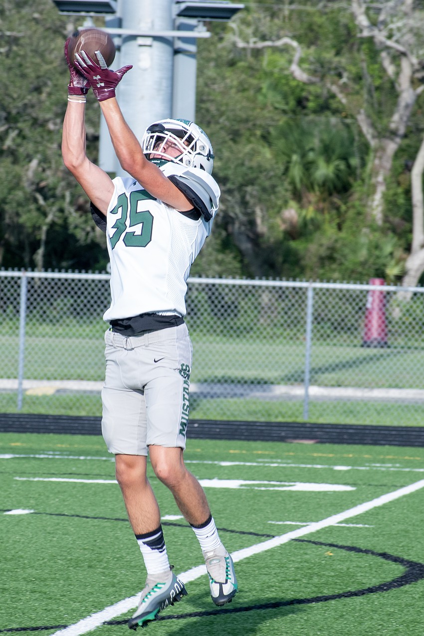 Lakewood Ranch junior safety Levi Owens catches a pass during warm-ups.