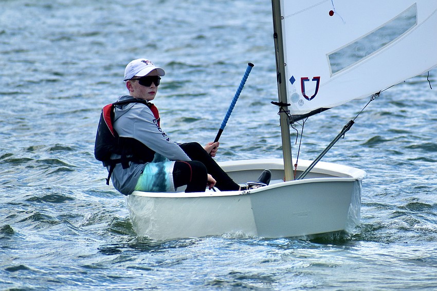 Eddie Miersch (Optimist RWB — Blue) of Sarasota Yacht Club focuses on the course ahead.