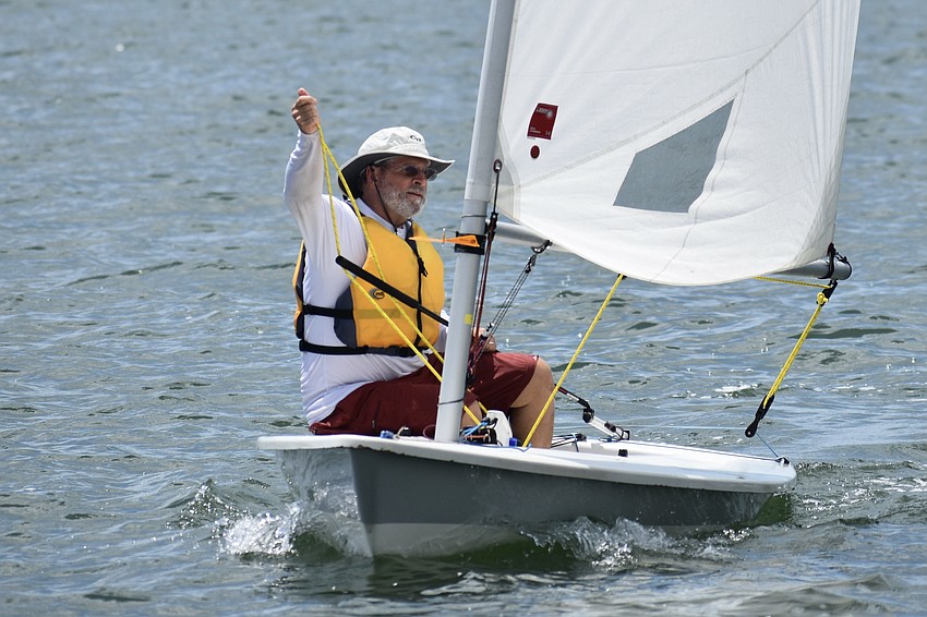 Timothy Parker of Lorain Harbor Boat Club sails a Laser.