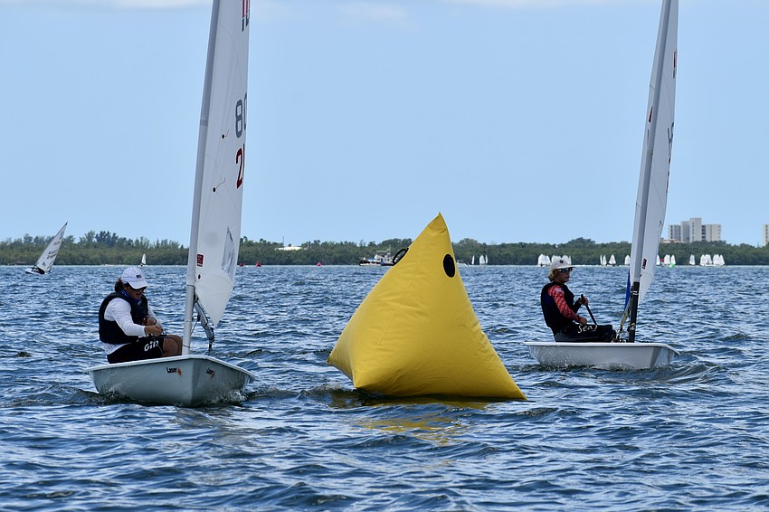 Ethan Perri of Sarasota Yacht Club and Ryder Ellis of St. Petersburg Yacht Club race in Lasers.