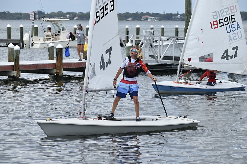 Finnegan Cox of St. Petersburg Yacht Club brings his Laser in to the dock.