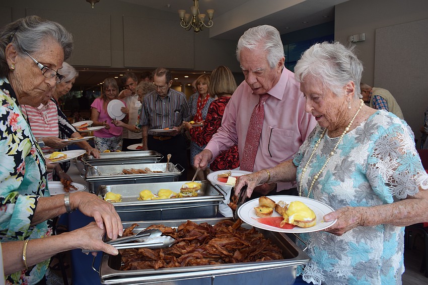 Bruce Schaefer and Jean Hanna getting food at the Chapel Labor Day brunch on Sept. 3.