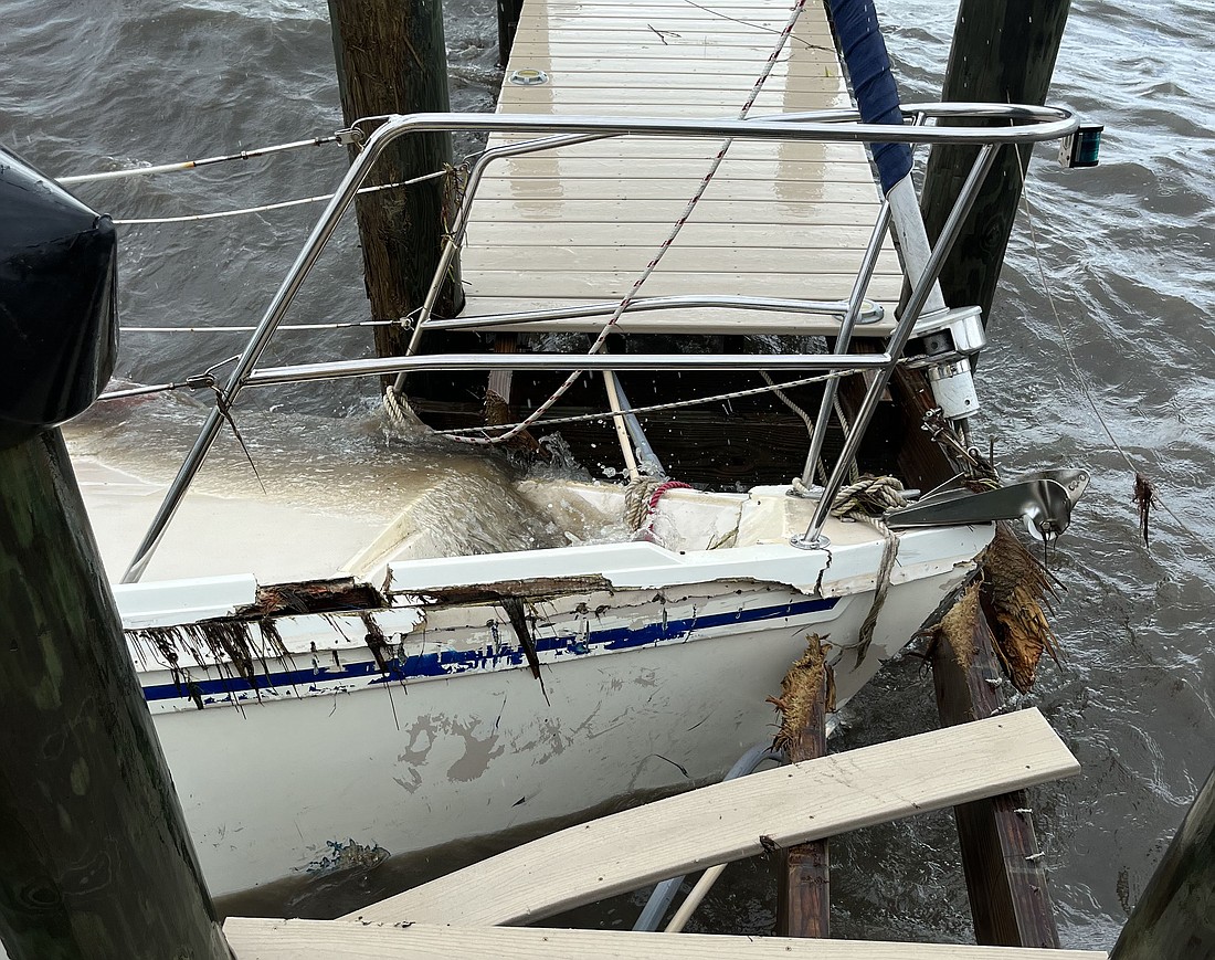 A sailboat crashed into the dock owned by Michael and Desiree Trahan hard enough to move the dock. The wreckage remains with no indication of when it can be removed.