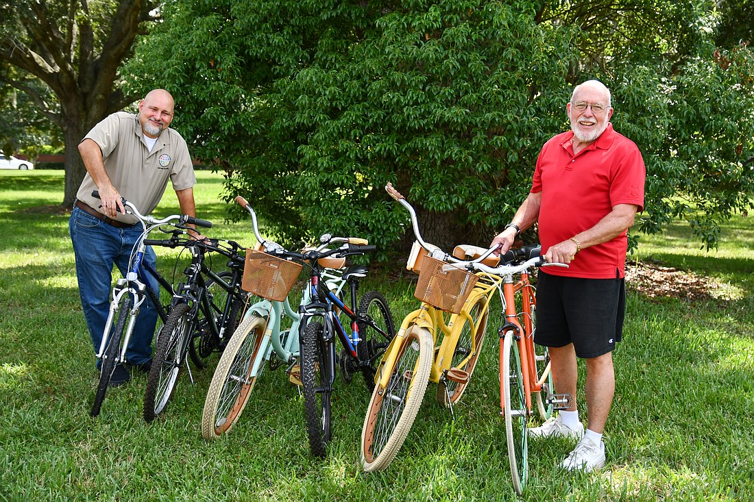 People of Faith Lutheran pastor Rick Kristoff and church member Roger Rutledge are proud of the church’s bike ministry.