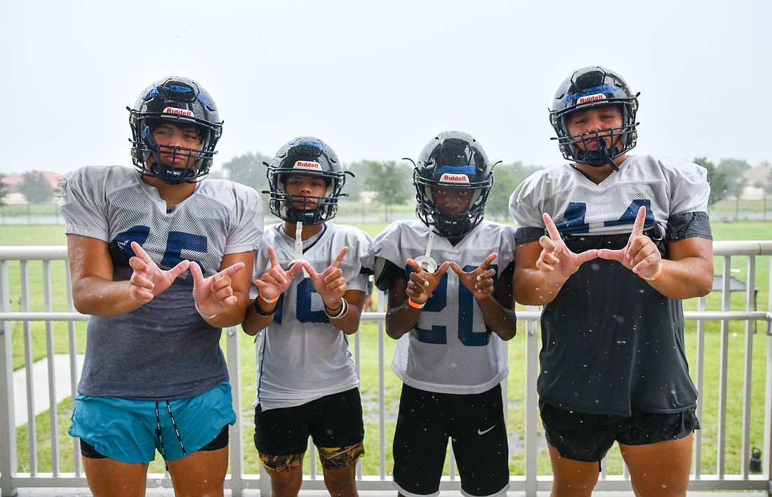 Theo and Enzo Fernandes (left and right), Octavio Ulloa and Braylen Speed play multiple sports for the Wolverines.