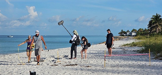 Terri and Jeff Driver, left, are filmed volunteering for Longboat Key Turtle Watch. Troy Logan, Natasha Thornton and Patrick Alexander manage the filming.