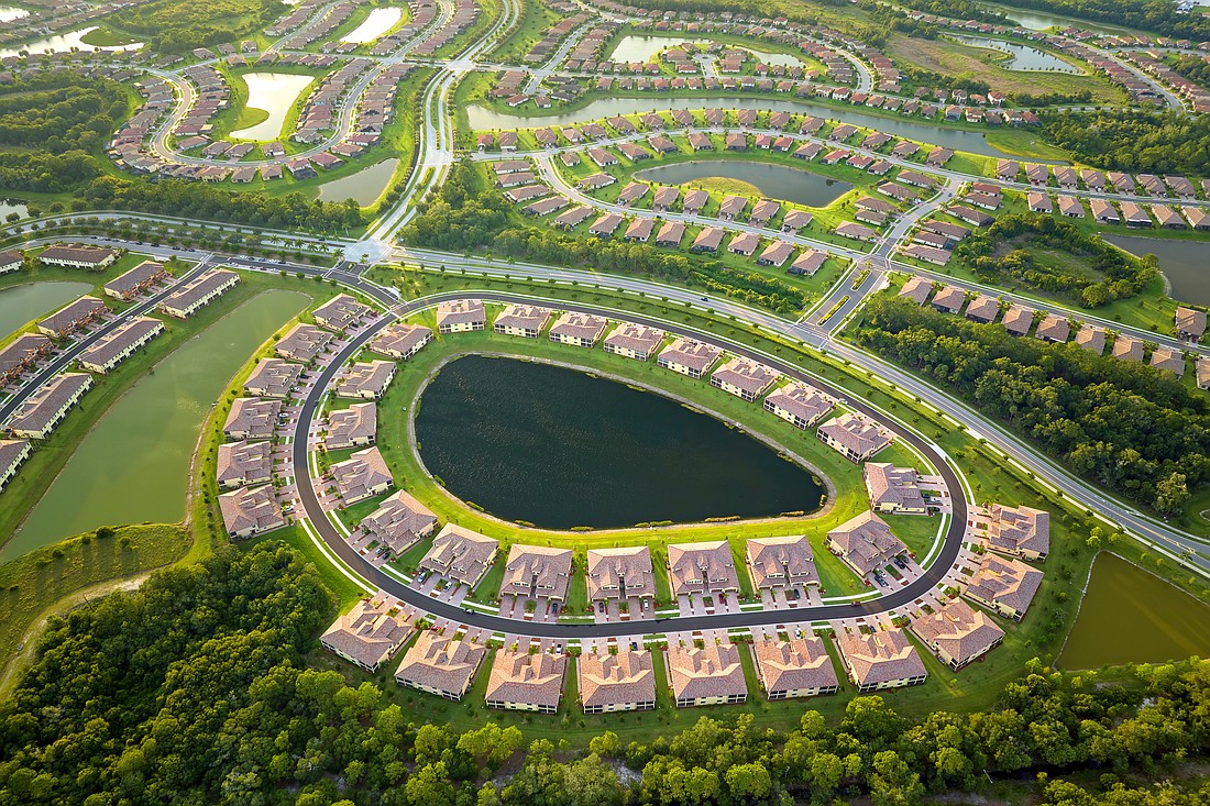 Houses and retention ponds in South Florida. Photo from Adobe Stock