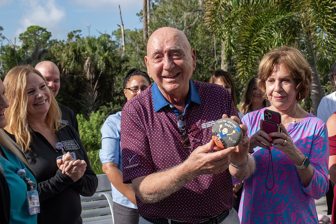 Dick Vitale was presented with a rock that reads "You're Awesome, Baby" following the completion of his final radiation treatment for vocal cord cancer.