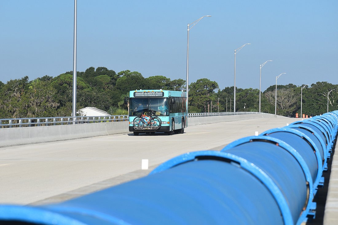 Manatee County Commissioners and dignitaries board a bus to have the honor of taking the first official trip on the 44th Avenue Bridge across the Braden River on Aug. 7.