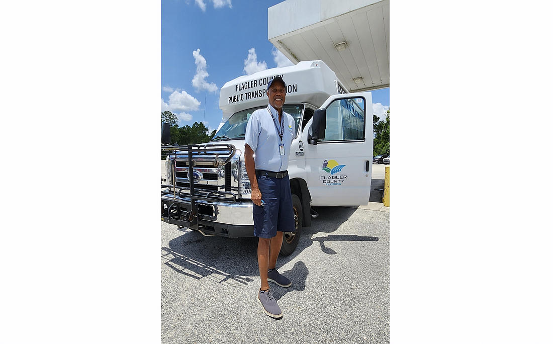 Driver Richard Briggs with a county paratransit bus. Photo courtesy of the Flagler County government