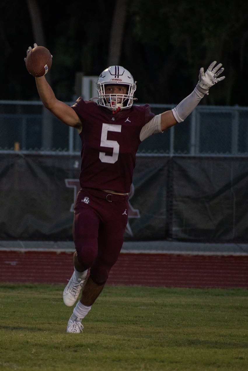 Braden River senior defensive back Ryan Peters celebrates after an interception.