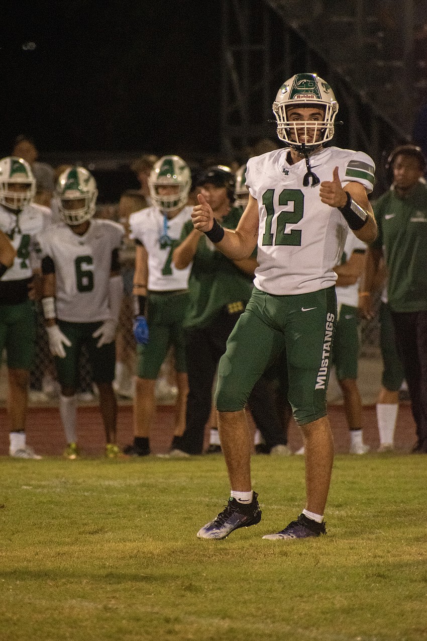 Lakewood Ranch senior quarterback Sebastian Mejia checks with the referees to make sure his team is lined up correctly.