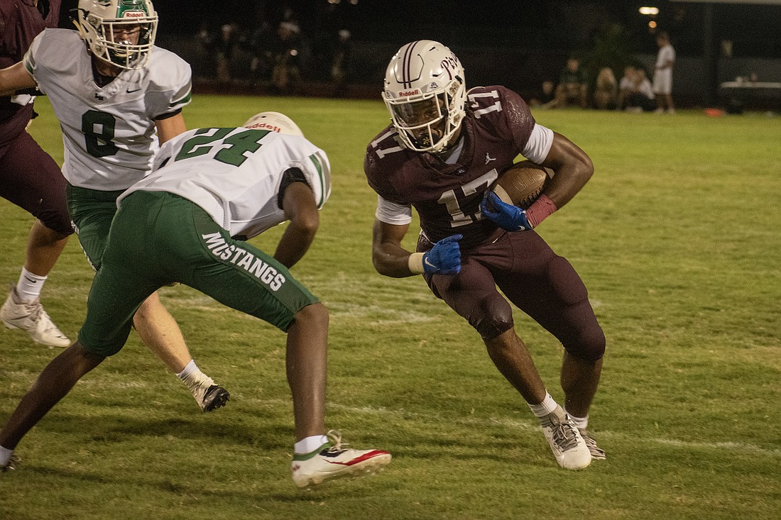 Braden River junior Yahshua Edwards (17) leans into a hit from Lakewood Ranch junior defensive back Mike Turner (24). Edwards had four total touchdowns against the Mustangs.