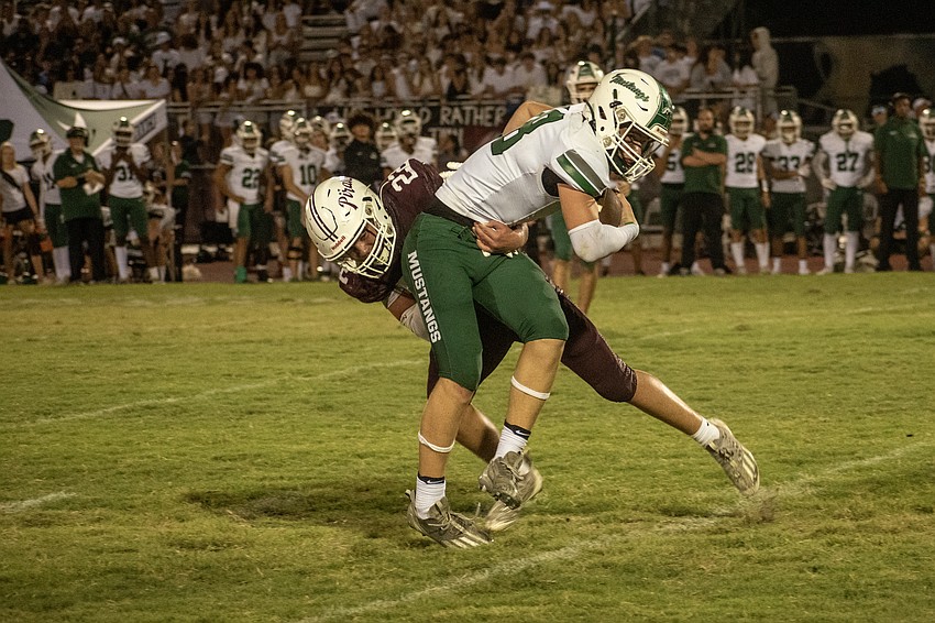 Braden River junior Brandon Wolf puts a hit on Lakewood Ranch sophomore tight end Cooper Orzel.