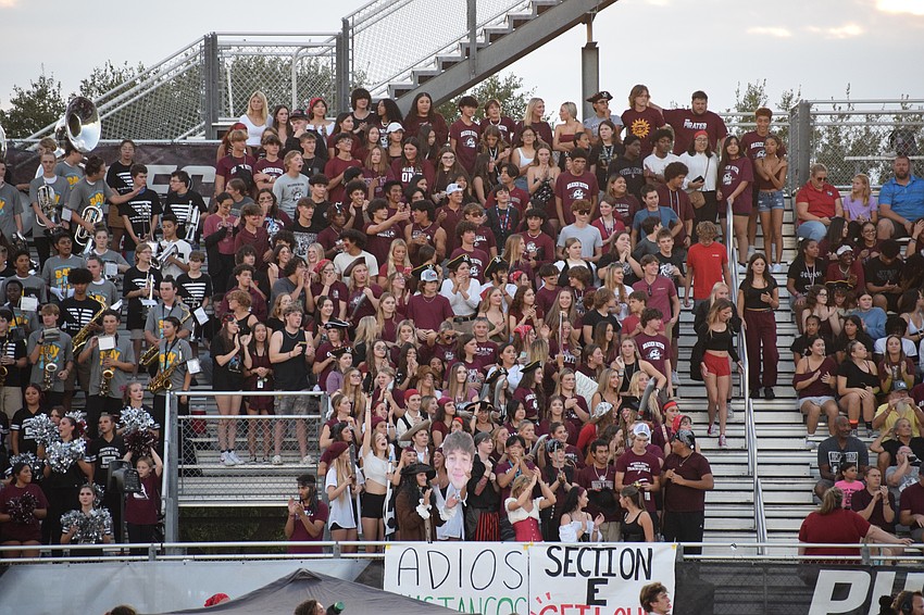 Braden River High School students pack Section E, the designated student section. There are so many students who want to be in Section E during games that the school's Student Government Association has to turn students away once the section reaches capacity.