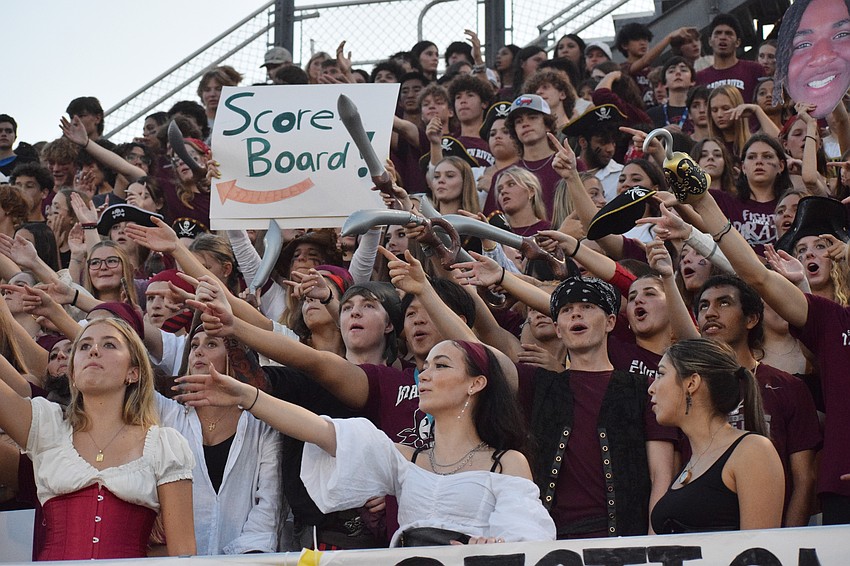 Braden River High School students remind Lakewood Ranch High School students of the score on the scoreboard after Lakewood Ranch scores a touchdown. With about 2 minutes left in the first half, Braden River was leading Lakewood Ranch 27-13.