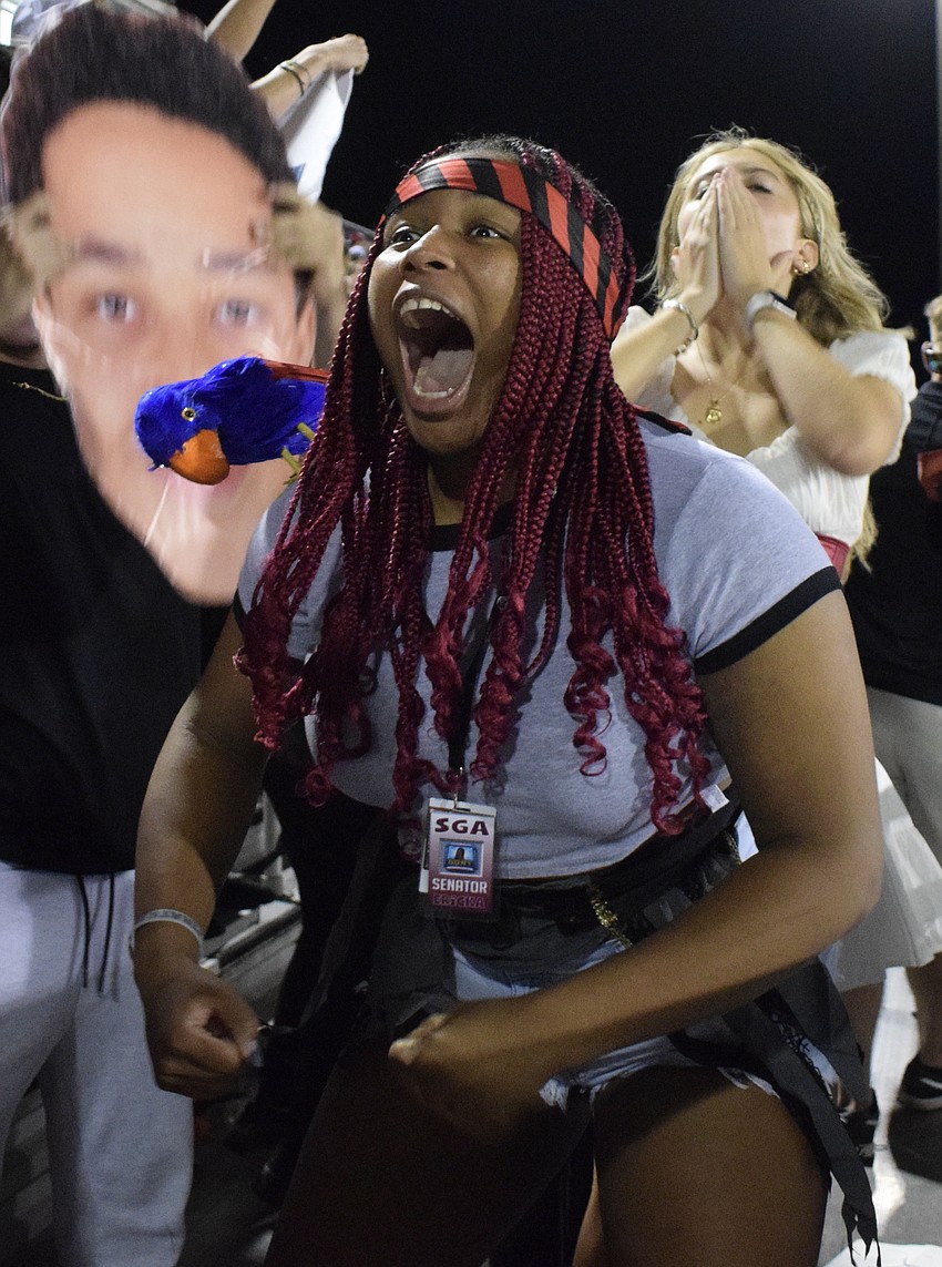 Braden River High School senior Erica Freeman, who is the senator of Student Government Association, cheers as loud as she can after the team scores a touchdown.