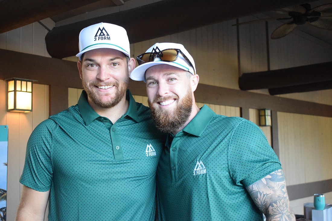 Victor Davis and Michael Demarski, the owner of 3Form Fitness, are ready to start 3Form Fitness' first charity golf tournament at Legacy Golf Club.
