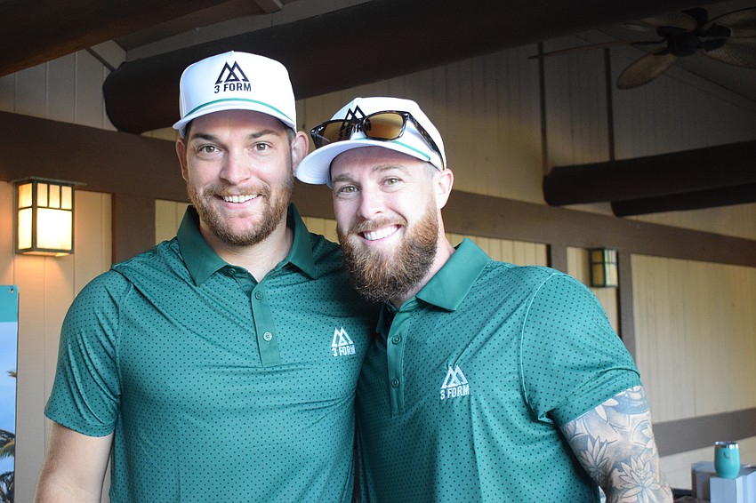Victor Davis and Michael Demarski, the owner of 3Form Fitness, are ready to start 3Form Fitness' first charity golf tournament at Legacy Golf Club.