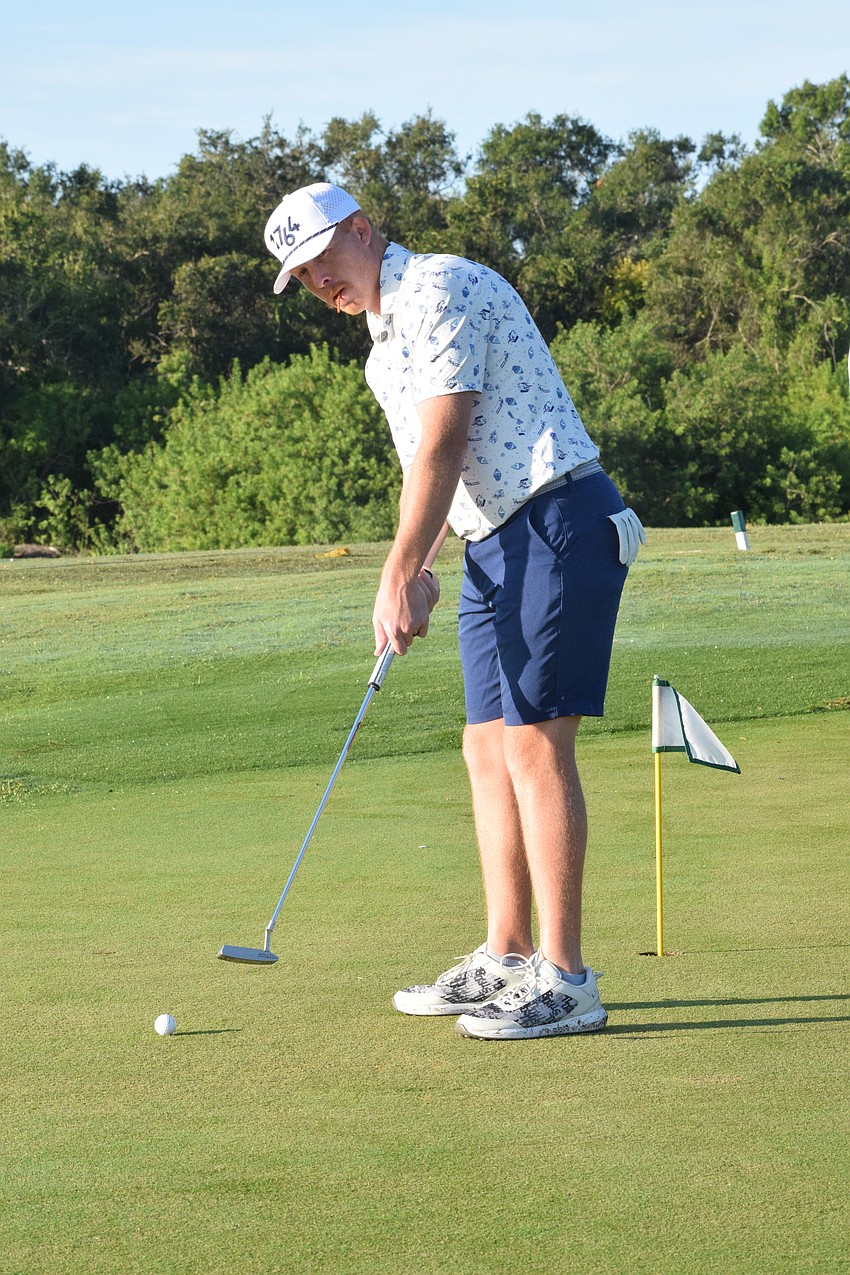 Lakewood Ranch's Corey Flynn practices his putting before the tournament begins. 