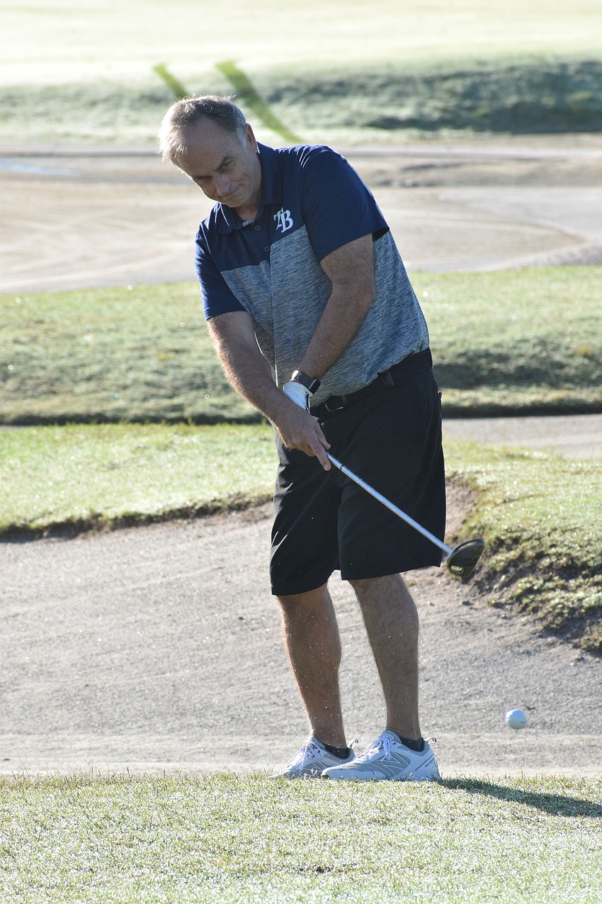 Sarasota's Paul MacPhail is the first of his group to chip his ball onto the green.