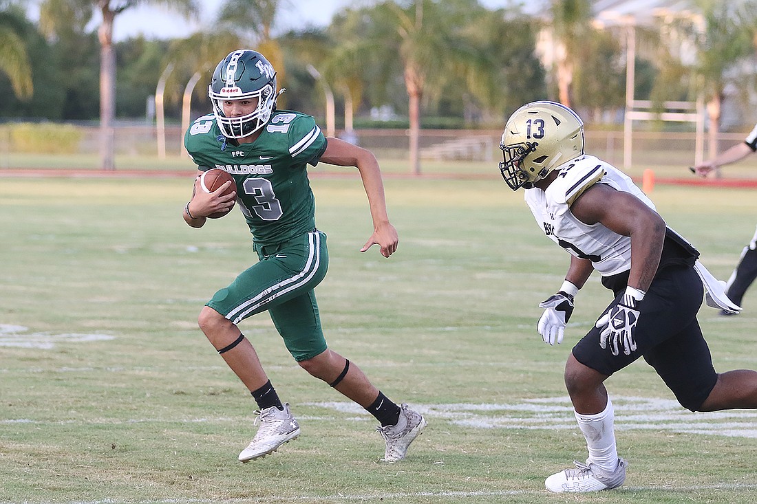 FPC quarterback Caden Gonzalez (13) runs a keeper as Bishop Moore's O’Mari Reid (13) looks to make the tackle in a game on Sept. 8. A holding penalty negated the play. File photo by Christine Rodenbaugh