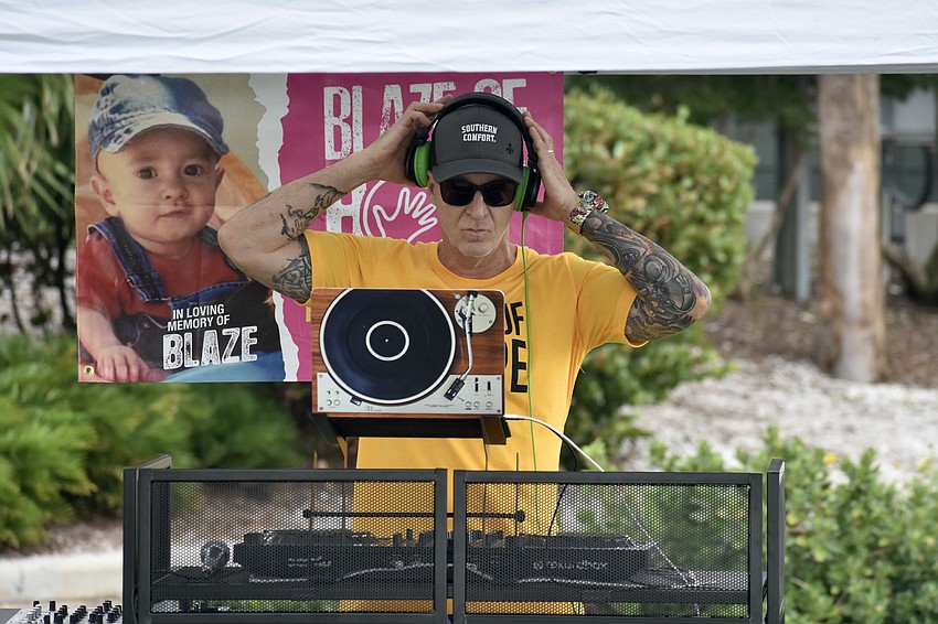 John Hollingsworth serves as DJ at the event.