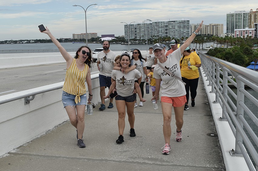 Brittany Gerren, 2-year-old Will Chandler, Amanda Chandler and Courtney Wheiland take the walk.