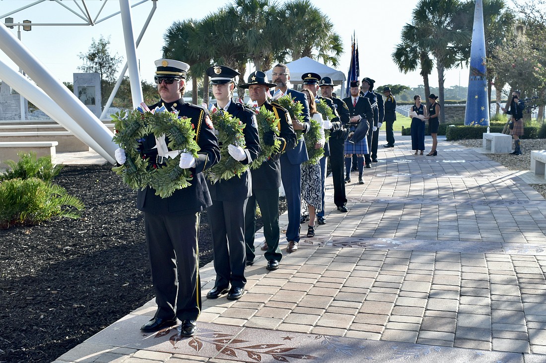 Members of the Sarasota Police Department and others line up for the wreath placement ceremony.