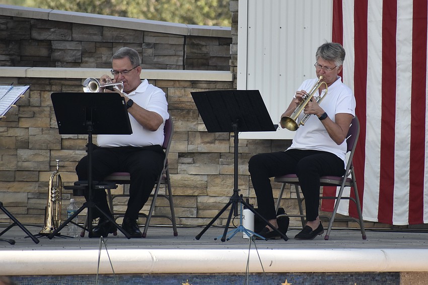 Jim Hill and Julie Waters of Braden River Brass help initiate the ceremony with the group's performance.