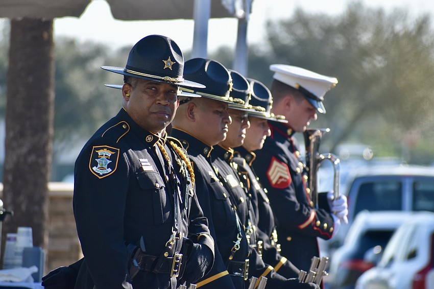 Members of the Sarasota County Sheriff's Office prepare to offer the 21-gun salute.