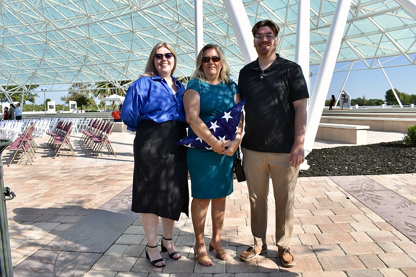 Sarah Bjelke; Kelly Bjelke, who was presnted with a flag in honor of David Bjelke, and Ryan Bjelke, of Plant City.