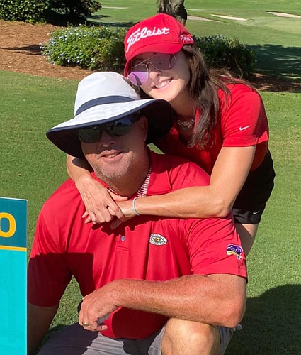 Chris Couch shares his love of golf with his wife, Julia.