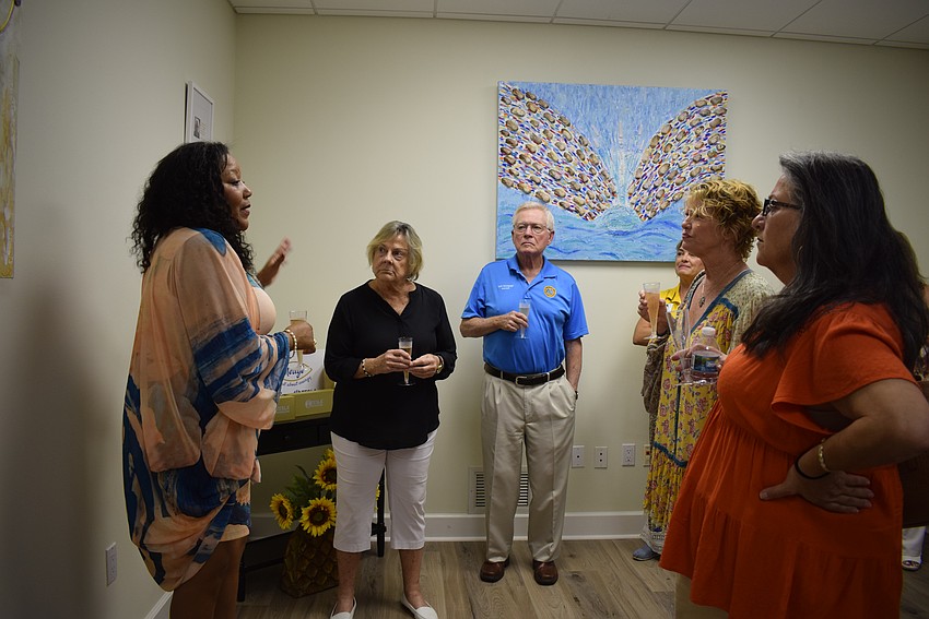 Medge Jaspan talking about the Tesla Biohealing technology to Chamber president Gail Loefgren, Mayor Ken Schneier, Julie Wilson and Sophia Emanuelli.