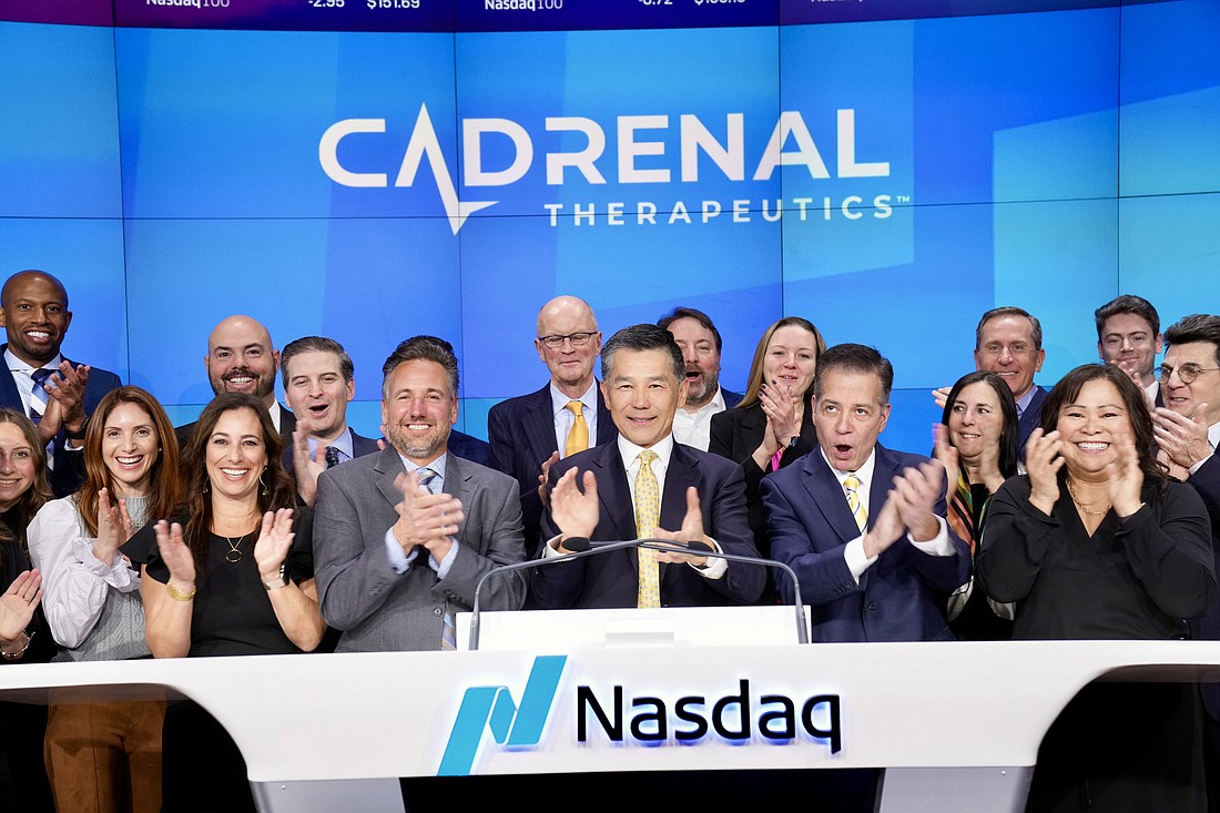 Cadrenal Therapeutics CEO and founder Quang Pham, center, applauds in the closing bell ceremony Feb. 8 at the Nasdaq stock exchange in New York.