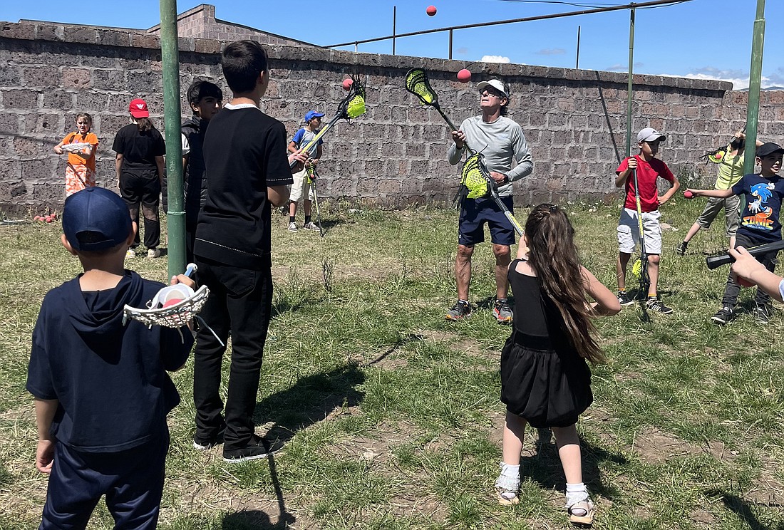 Johnny Mouradian coached a clinic for The Armenian Youth Lacrosse Mission at Debi Arach Children's Center.