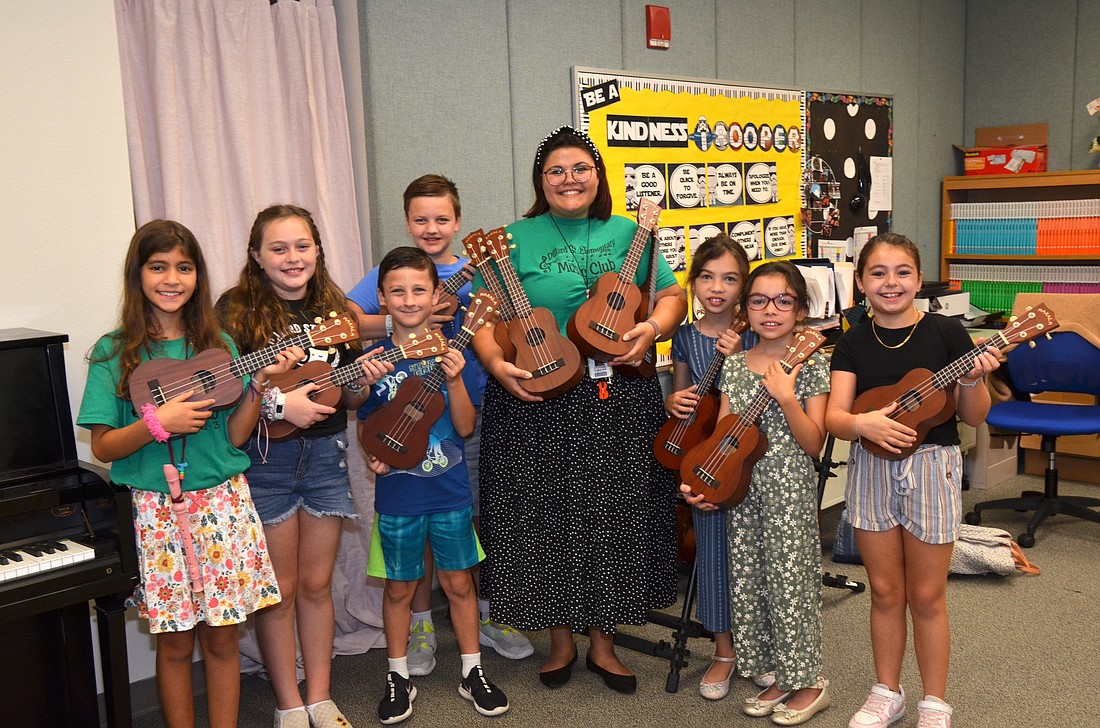 Music teacher Stephanie Bryant is eager to teach ukulele music to her students, including Paula Carrasquel Mora, Lillyann Beier, Walter Wootton, Crew Wootton, Catalina Fiallo, Milena Fiallo and Madison Jackson.