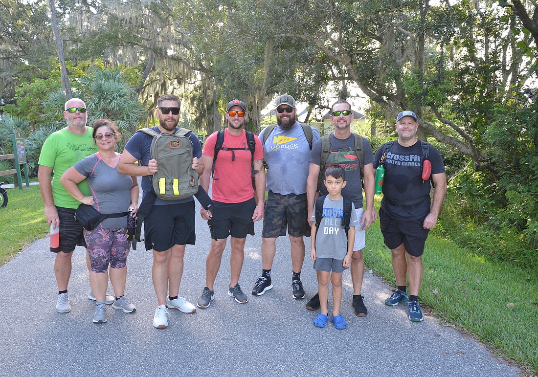 Member of the West Orange Ruckers don their backpacks and hit the West Orange Trail for a three-mile hike three times each week.